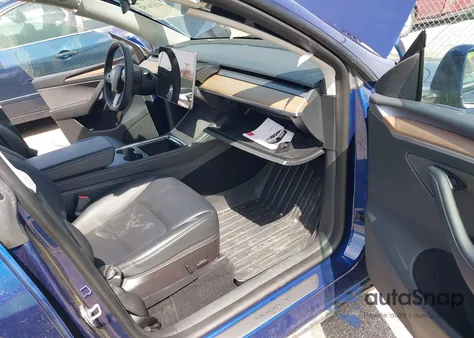 2023 Tesla Model Y Awd/Long Range Dual Motor All-Wheel Drive z USA, uszkodzony, nr VIN 7SAYGDEE7PF702051